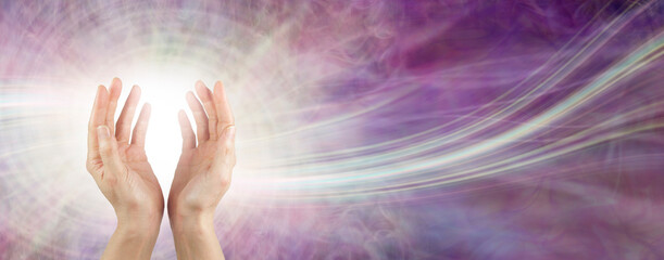 Sending beautiful healing intention across the ether - female open cupped hands with a white orb...