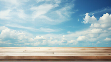 Empty wooden table blue sky and clouds