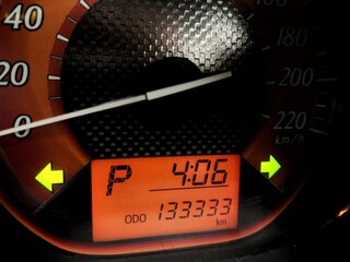 Close up Instrument automobile panel of distance 133,333 kilometer and 4.06 O'Clock.