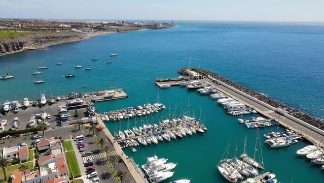 Rotating drone shot of the port of Pasito Blanco in Gran Canaria, Spain