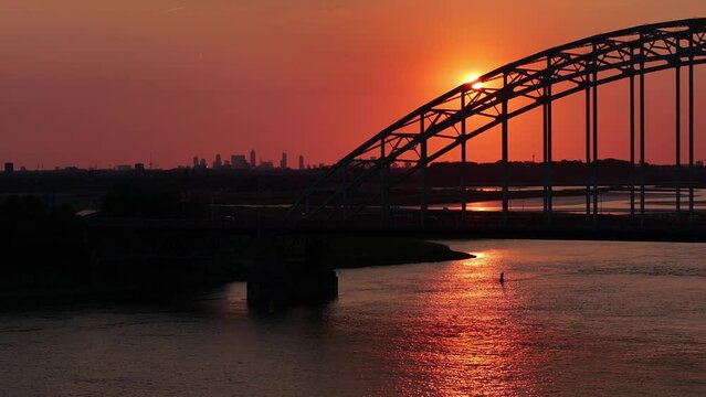 Stunning orange sunset, Hendrik ido Ambacht bridge over the River Noord, Rotterdam
