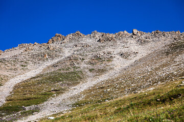 Fototapeta premium The ridge of the mountain against the background of an amazing blue sky