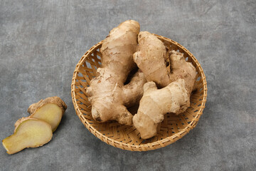 Fresh Ginger (Zingiber officinale) or Jahe on bamboo plate 
