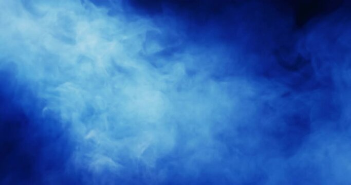 Video of blue clouds of smoke moving with copy space on black background