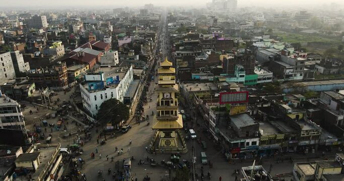 Golden Clock Tower at Birgunj Nepal. Aerial Drone Shot. Asia Busy Street and Border Area. Urban City, Golden Hour, Busy Roads, Landscape. For Travel, Monuments, Scenic, Relaxation, Nature video.