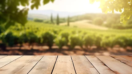 Foto op Plexiglas Empty wooden boards, weathered planks table top with blur background of vineyard at sunny summer day. © Scovad