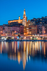 Cityscape of Menton at night, a historic town in the Provence-Alpes-Côte d'Azur region on the...