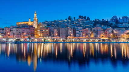 Cityscape of Menton at night, a historic town in the Provence-Alpes-Côte d'Azur region on the...