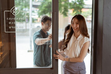 Group of Asian teenagers entering a bakery shop together. Man and women visiting a cafe with smile