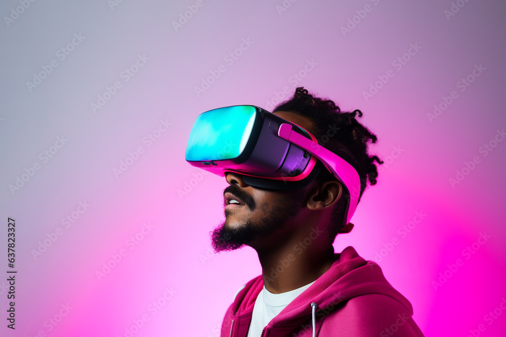 Wall mural young man wearing virtual reality vr glasses, vr headset and trying to touch something with his hand