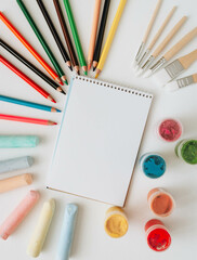 Materials for children's drawing. Children's preschool art on a white background. Top view.