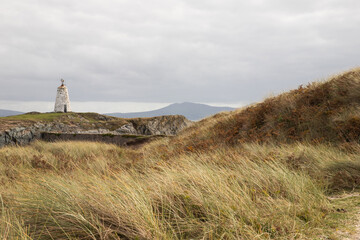 Fototapeta na wymiar Twr Bach lighthouse on Llanddwyn, along the coast of Anglesey, Wales