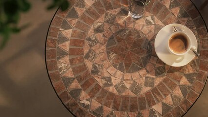 Top Down View on an Empty Coffee Table in a Cafe. Decorated Tabletop with Coffee, Notebook and Pencil, Outdoors in a Busy Street. Background for Text for Wellness, Service Business and Traveling