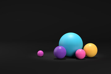 Colorful spheres on dark black background.