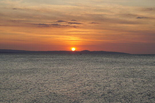 the sunset behind the Semau island, Indonesia