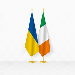 Ukraine and Ireland flags on flag stand, illustration for diplomacy and other meeting between Ukraine and Ireland.