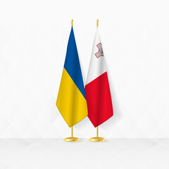 Ukraine and Malta flags on flag stand, illustration for diplomacy and other meeting between Ukraine and Malta.