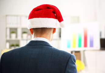 Man in suit wearing traditional red cap sit backward waiting 2018 year coming in office