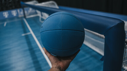 Goalball next to net in hand