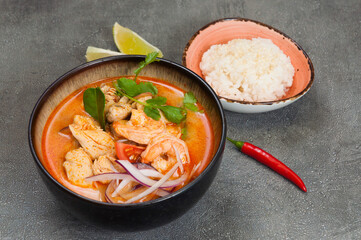 popular spicy Thai tom yam soup with chicken and shrimp. served with rice