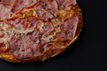 Delicious pizza prosciutto with ham and mozzarella