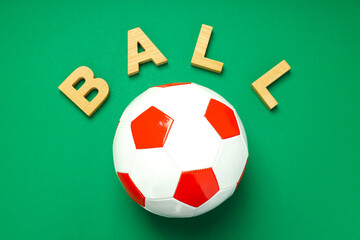 Word Ball and football ball on green background