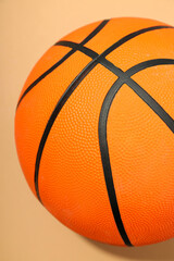 Basketball ball on beige background, concept of balls