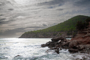Fototapeta na wymiar Cloudy day in a shore green mountain