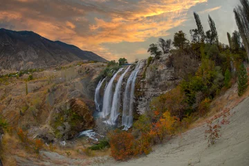 Foto auf Glas Tortum Waterfall, located in Erzurum, Turkey, is one of the largest waterfalls in the country. © Samet