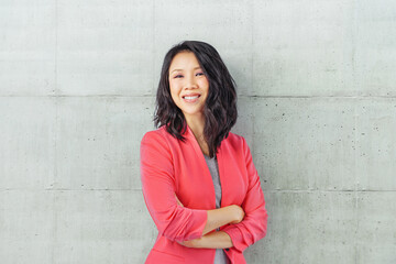  business woman lean on wall with copyspace at right side