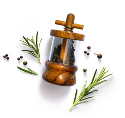 traditional italian pepper shaker and green organic rosemary leaves isolated on white background....