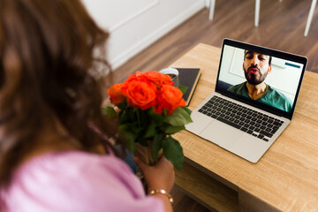 Boyfriend and girlfriend having a romantic virtual date - obrazy, fototapety, plakaty