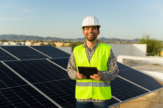 Attractive engineer installing solar panels and clean energy