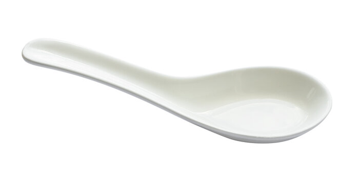white ceramic soup spoon cutout on white background