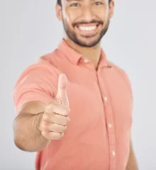 Zelfklevend Fotobehang Happy asian man, portrait and thumbs up in success, winning or good job against a white studio background. Male person smile with like emoji, yes sign or OK in agreement, thank you or approval © peopleimages.com