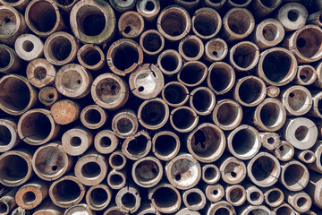 Textured background of pile bamboo pipes arranged in rows
