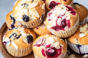 Fresh tasty muffins with berries and almond