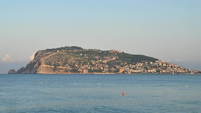Beautiful sundawn scene on Alanya beach with view to famous Alanya island, in Turkey