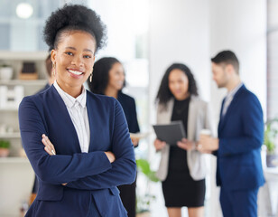Crossed arms, confidence and portrait of professional black woman in the office with a smile. Happy, career and young African female attorney with pride standing by a legal team in the workplace.