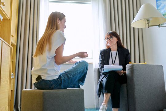 Female psychologist working with young teen girl