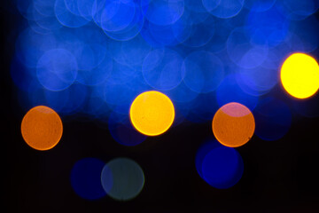 background blurred abstraction of colored lanterns and decorations. bokeh texture of street colored...