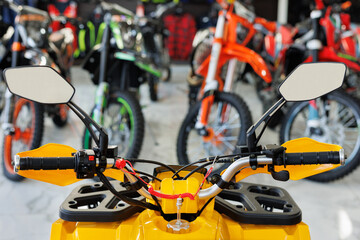 ATVs are sold in a motorcycle shop. Close-up of the control panel.