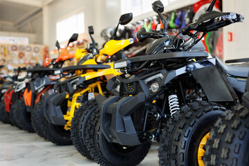 ATVs are sold in a motorcycle shop.