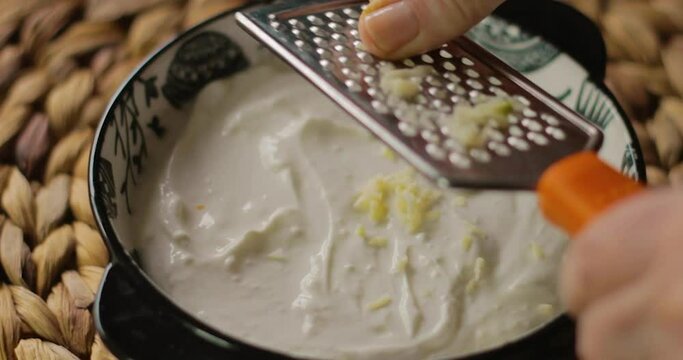 garlic yoghurt, grated garlic into the yoghurt in the bowl