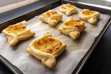 Puff pastry cheese square on black background.food concept. bakery.