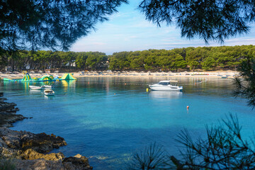 Beach and boats on the Adriatic coast. Primosten, Croatia. - obrazy, fototapety, plakaty