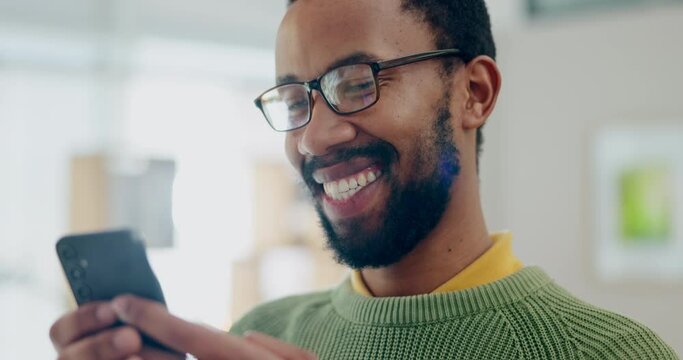 Phone, smile and social media with a black man laughing at a meme while in his office at work for business. Face, communication and a happy young employee looking at a text message on his mobile