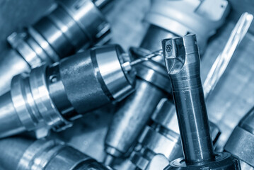 The group of various size of cutting tools in the container box.