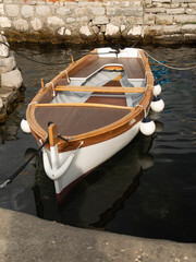 Small wooden boat in water in Montenegro, Europe