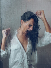 Expressive woman shouting desperately under shower